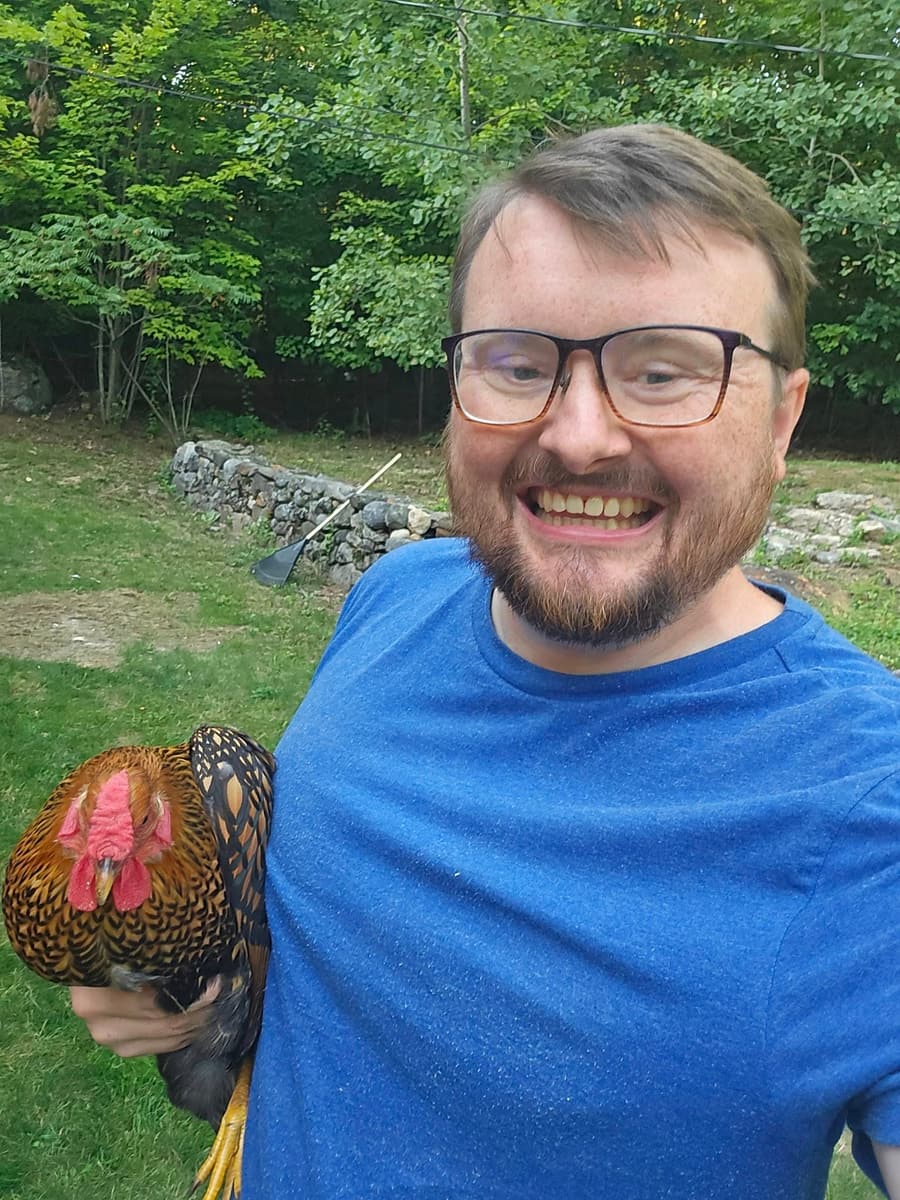 Ross Berry holding one of his chickens